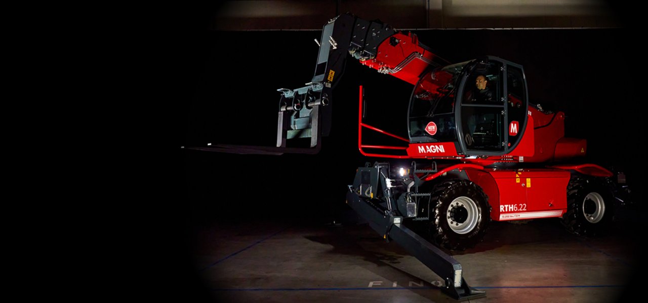 Red rotary telescopic handler in the dark