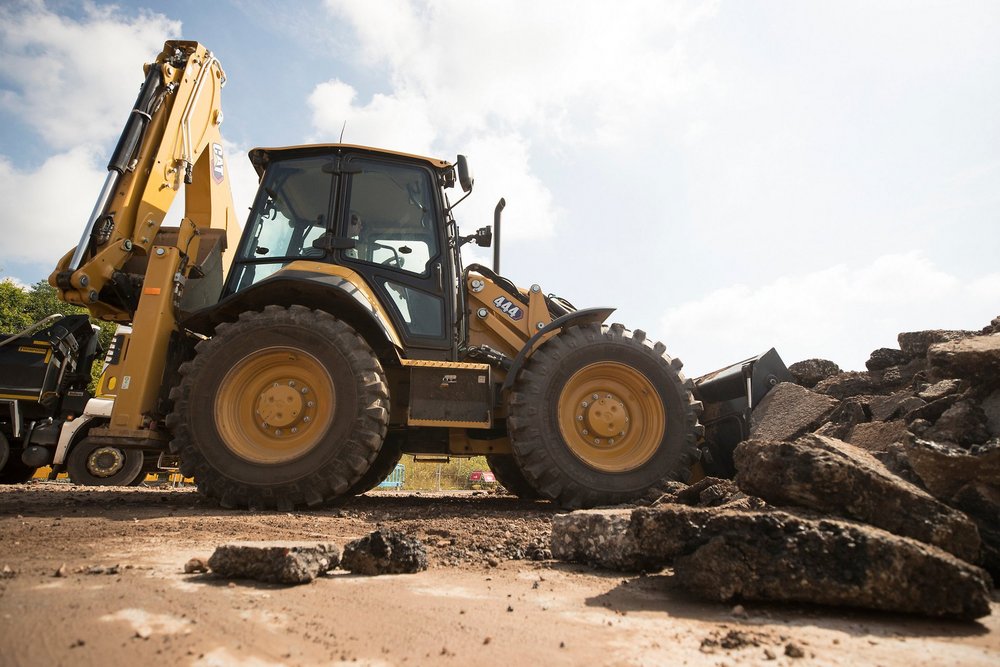 The Cat 444 backhoe loader