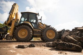 The Cat 444 backhoe loader